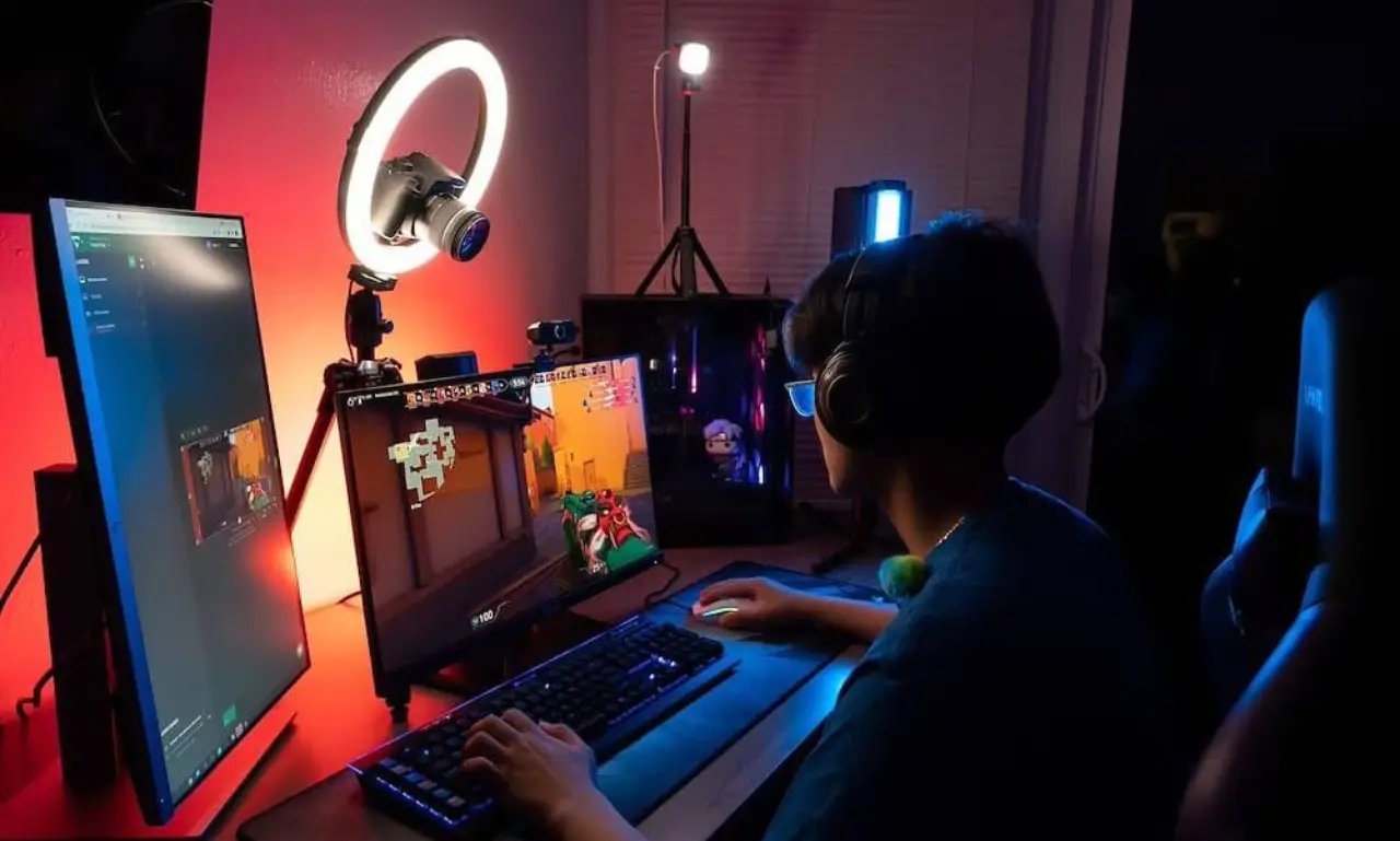 Beginner gaming channel setup with PC, microphone, and recording software for creating gaming content